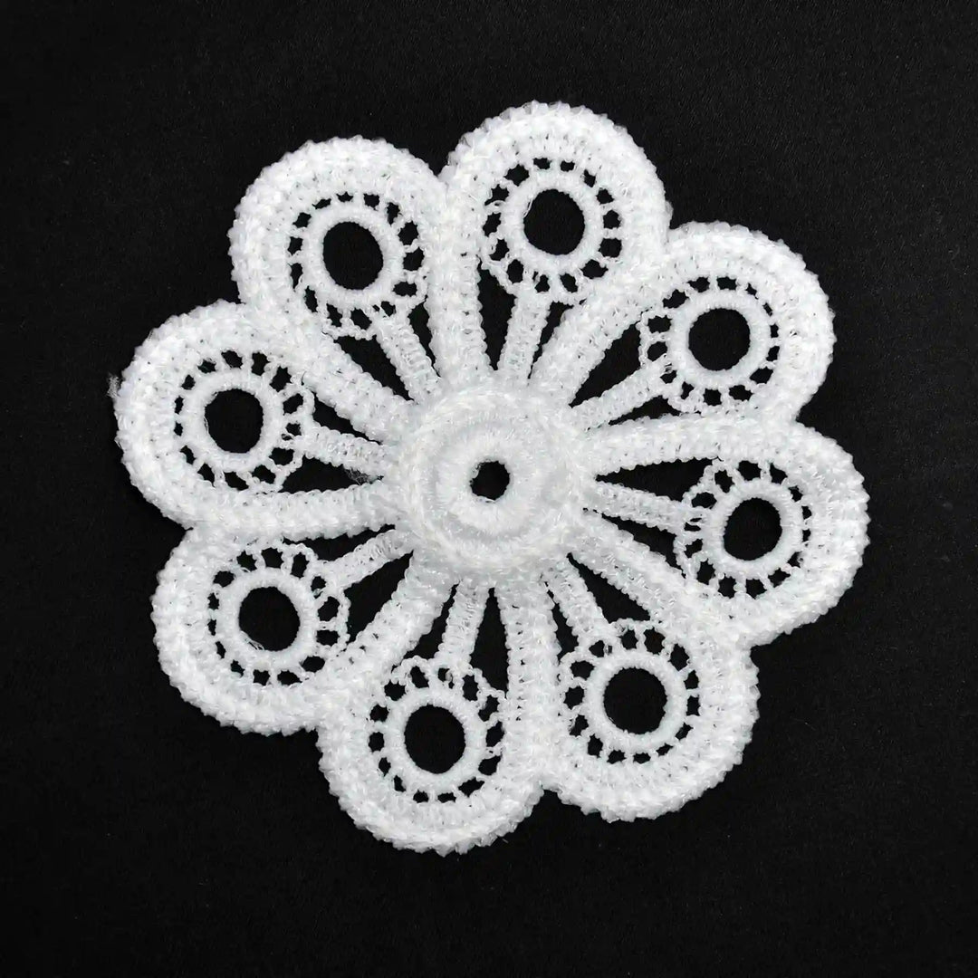 ANI Accessories white eight-petal flower patch with ring cut-outs, front view on black background 
