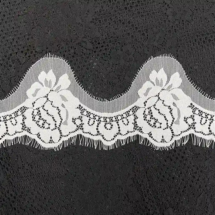 ANI Accessories white eyelash lace with a wavy rose design laid flat 