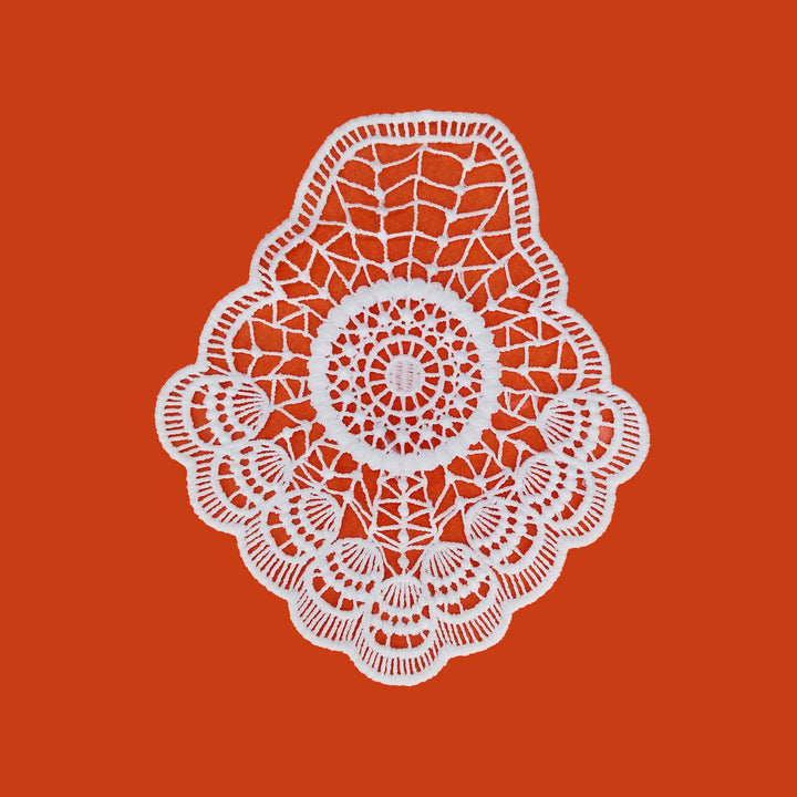 ANI Accessories white fabric patch for clothes with scalloped edge, on orange 
