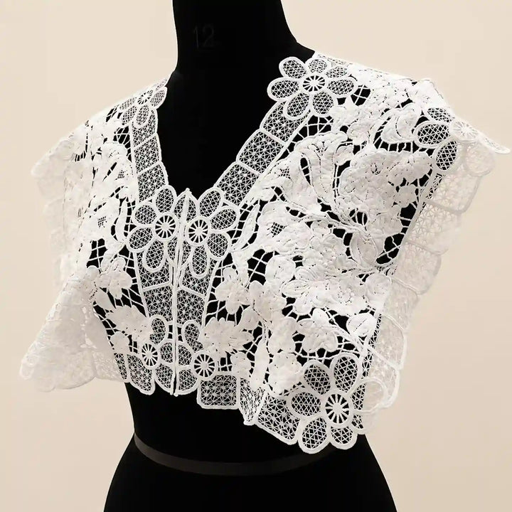 ANI Accessories white floral lace collar yoke on a black dress form, angled view of the shoulder and neckline