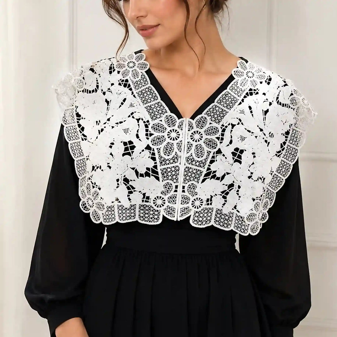 ANI Accessories white floral lace V-neck collar yoke worn by a model over a black long-sleeve dress with white color background 