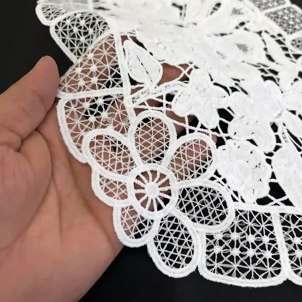ANI Accessories white floral lace yoke held in hand, close-up of daisy motif and grid mesh border 