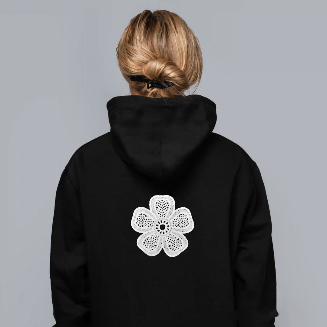 ANI Accessories white flower patch for hoodies on the back of a black hoodie