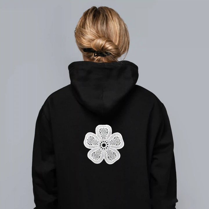 ANI Accessories white flower patch for hoodies on the back of a black hoodie