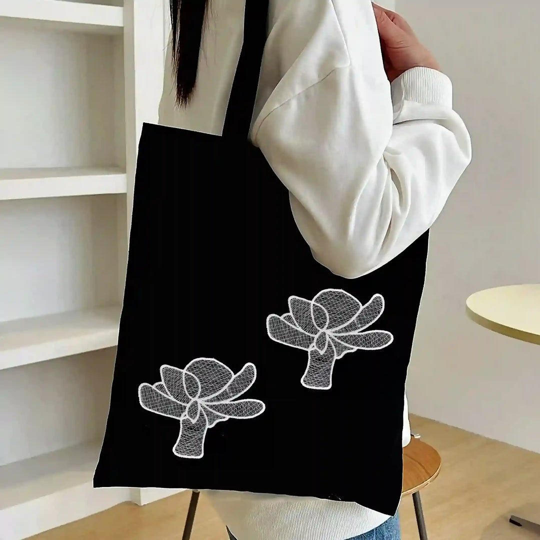 ANI Accessories two white flower patches stitched on a black tote bag 