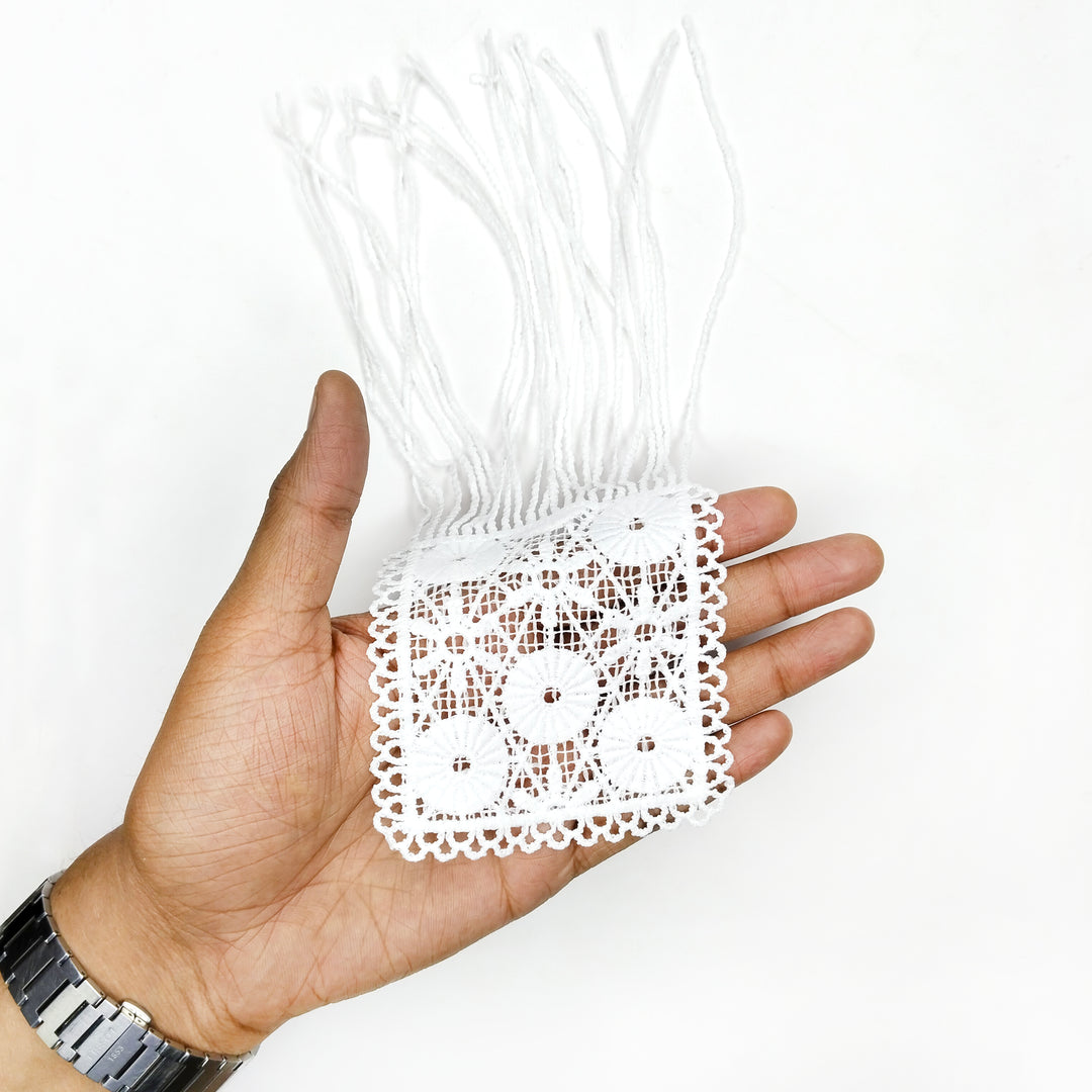 ANI Accessories white flower patch with fringe held in an open palm to show its size 
