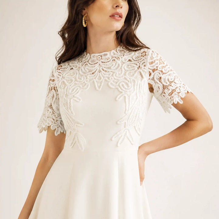 ANI Accessories white guipure lace yoke and sleeves on a model in a white dress for a white-on-white look 