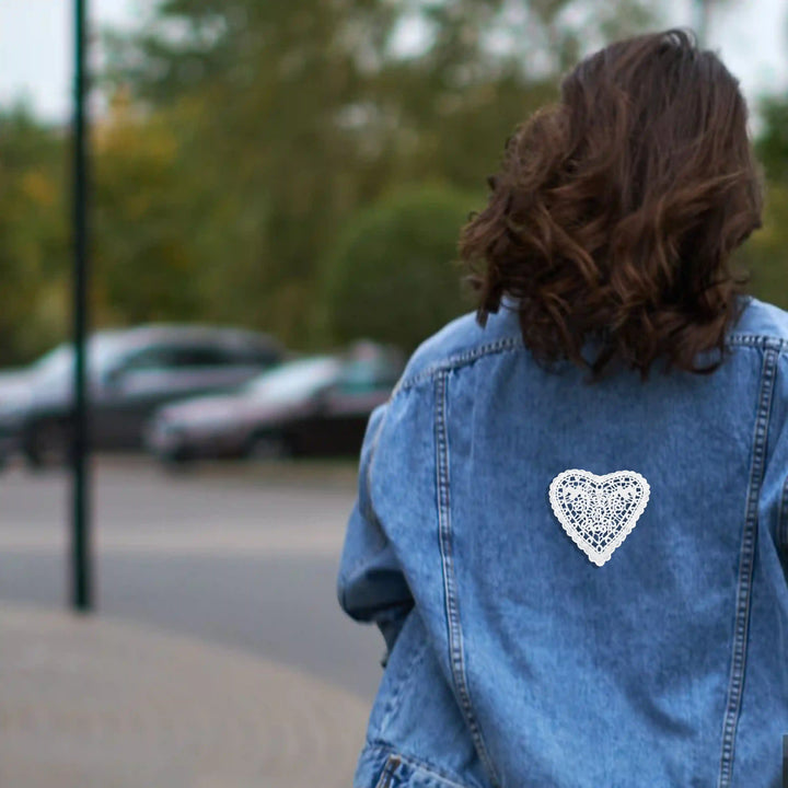 ANI Accessories white heart patch for jackets on the back of a blue denim jacket with daily lifestyle background 