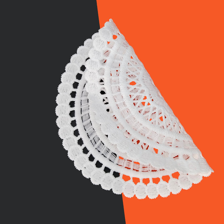 ANI Accessories white mandala patch folded in half to show how thin and flexible it is 