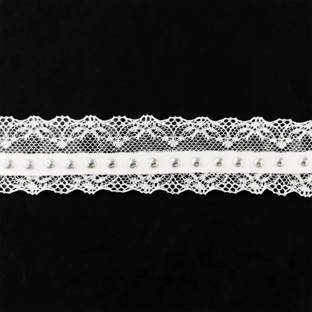 ANI Accessories white scallop lace trim with silver metal studs laid flat with black color background 
